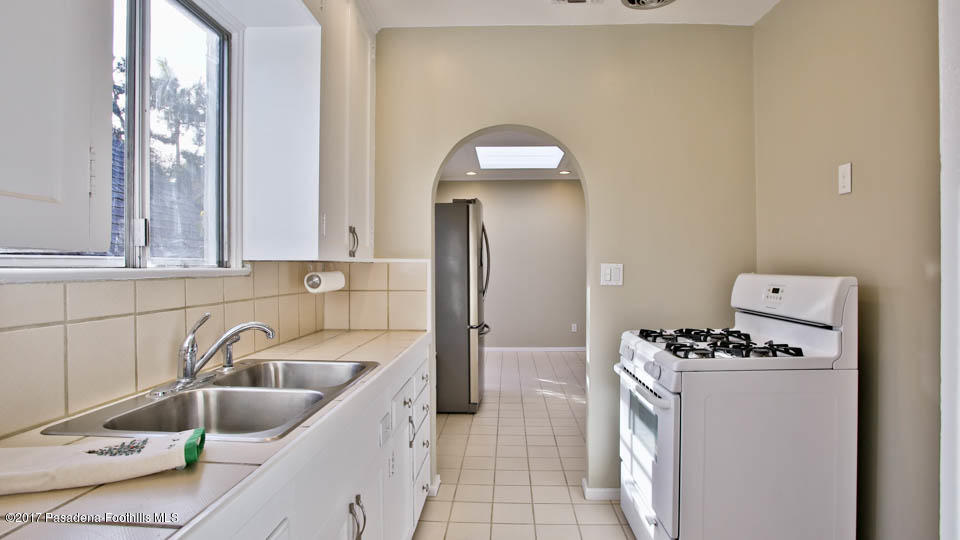 330 Fillmore Street Pasadena, CA 91106 - Photo 15 of 25 a kitchen with a sink and a refrigerator