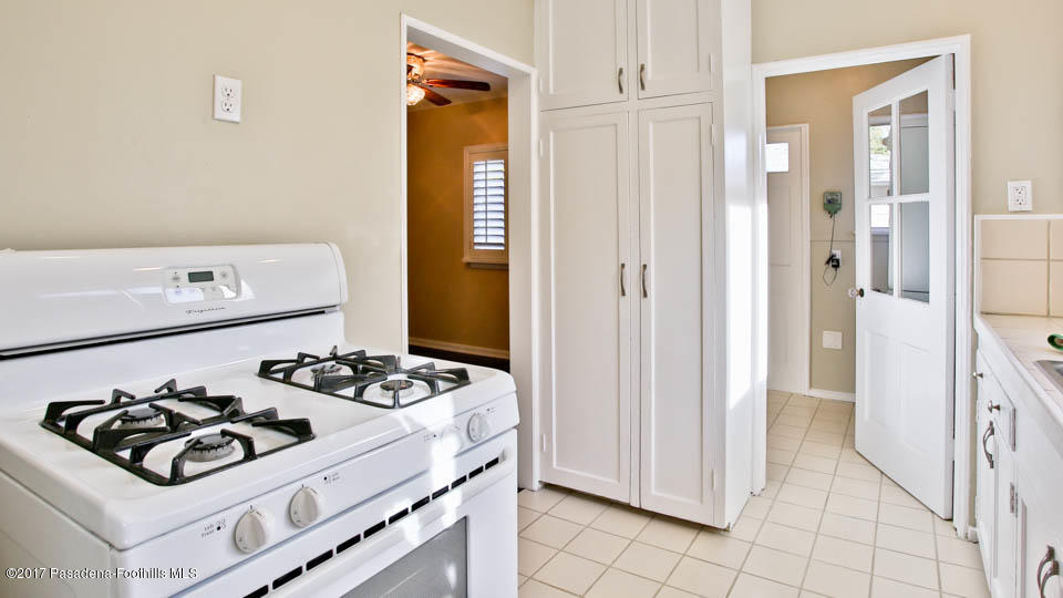 330 Fillmore Street Pasadena, CA 91106 - Photo 16 of 25 a white stove top oven sitting next to a white refrigerator
