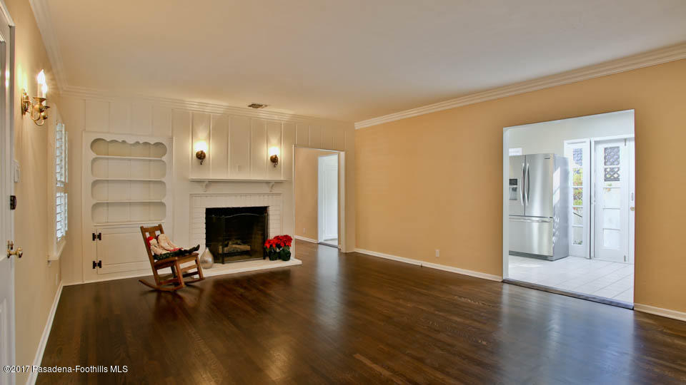 330 Fillmore Street Pasadena, CA 91106 - Photo 5 of 25 a living room with furniture wooden floor and a fireplace