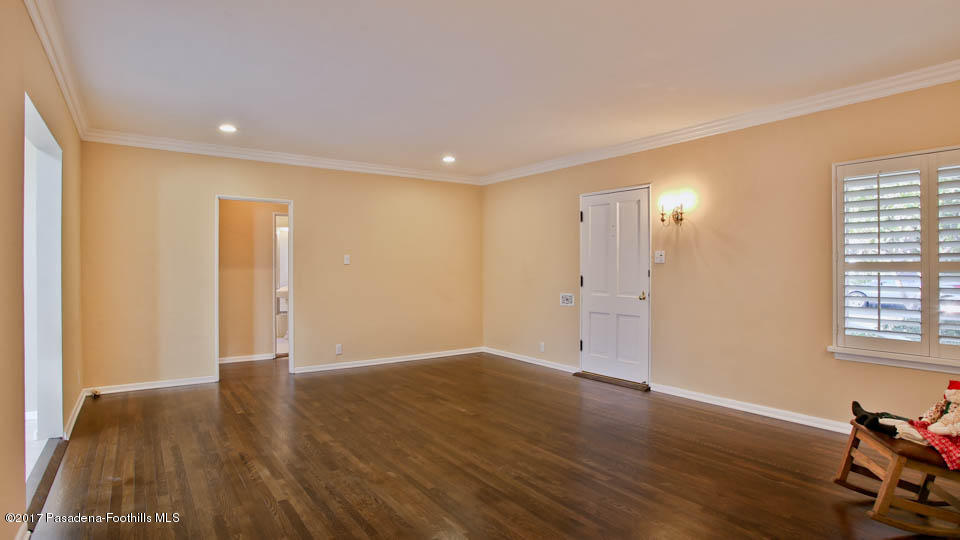 330 Fillmore Street Pasadena, CA 91106 - Photo 7 of 25 a view of an empty room with wooden floor and a window