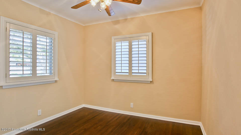 330 Fillmore Street Pasadena, CA 91106 - Photo 9 of 25 an empty room with a window and a ceiling fan