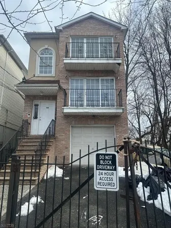 a front view of a house with parking