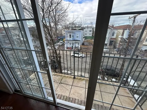 a view of balcony with a floor to ceiling window