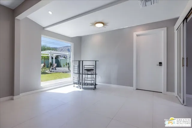 a view of an empty room with a window