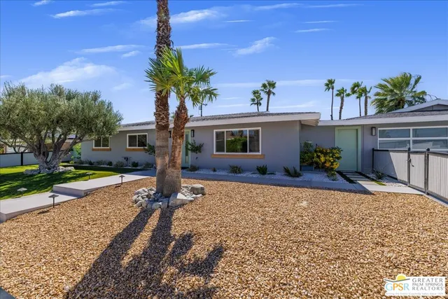 a house view with a garden space