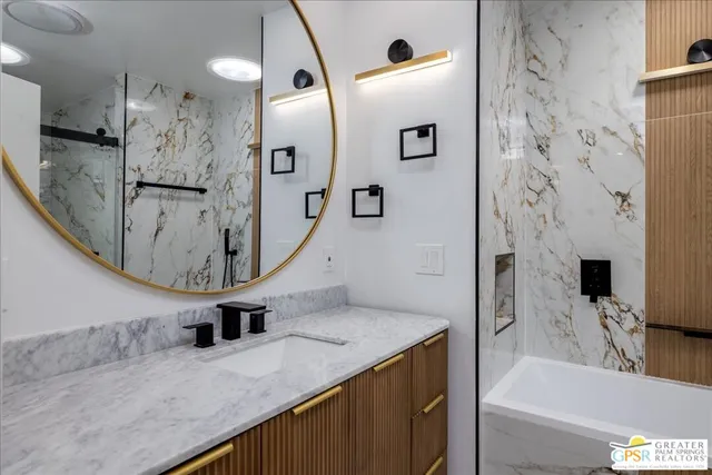 a bathroom with a bathtub and shower