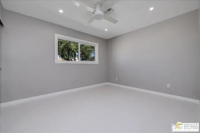 an empty room with a empty space and a window