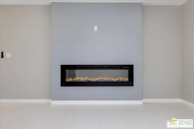 a view of a living room with a fireplace