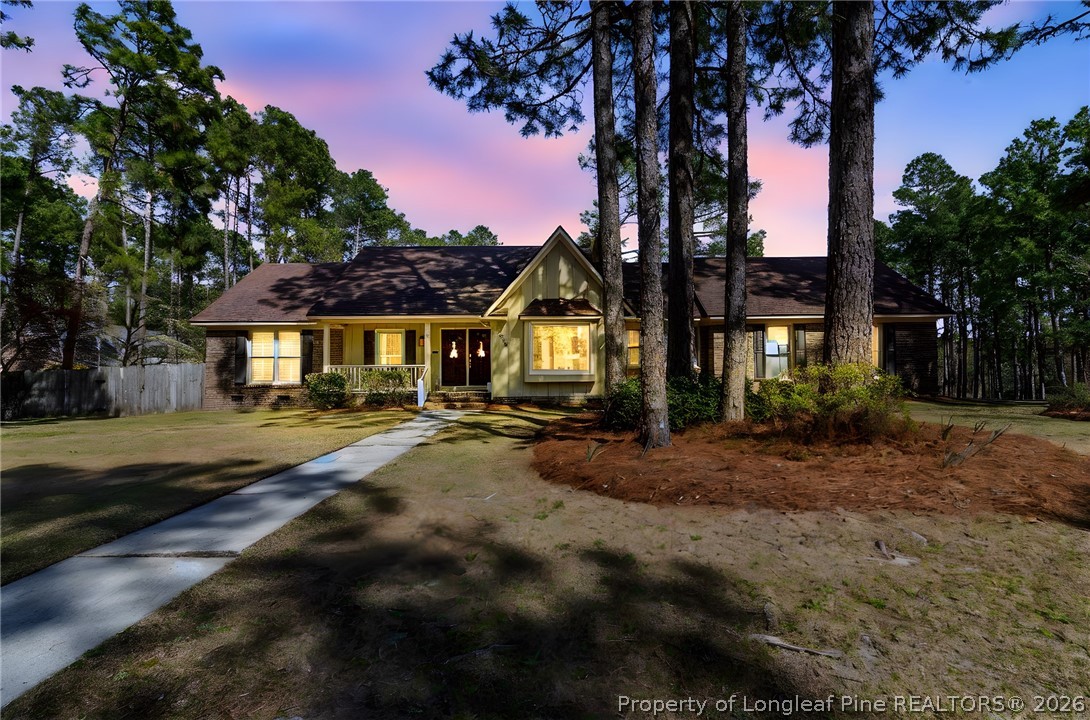 7756 Dragonhead Road Fayetteville, NC 28311 - Photo 1 of 42 a front view of a house with yard and green space