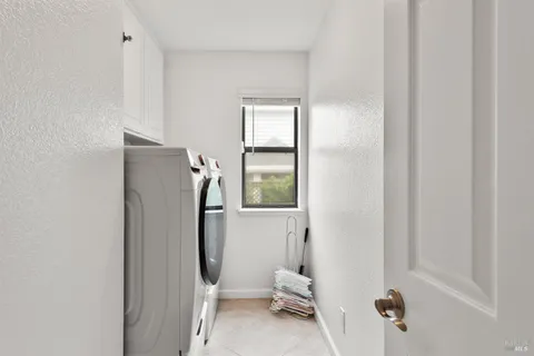 a bathroom with a window and a shower