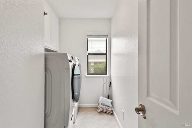 a bathroom with a window and a shower