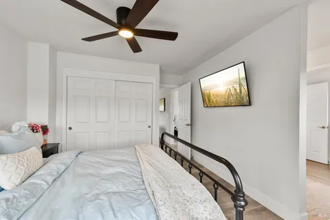 a bedroom with a bed and a chandelier