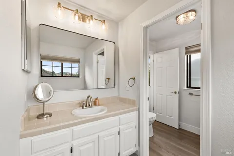 a bathroom with a sink double vanity and a mirror
