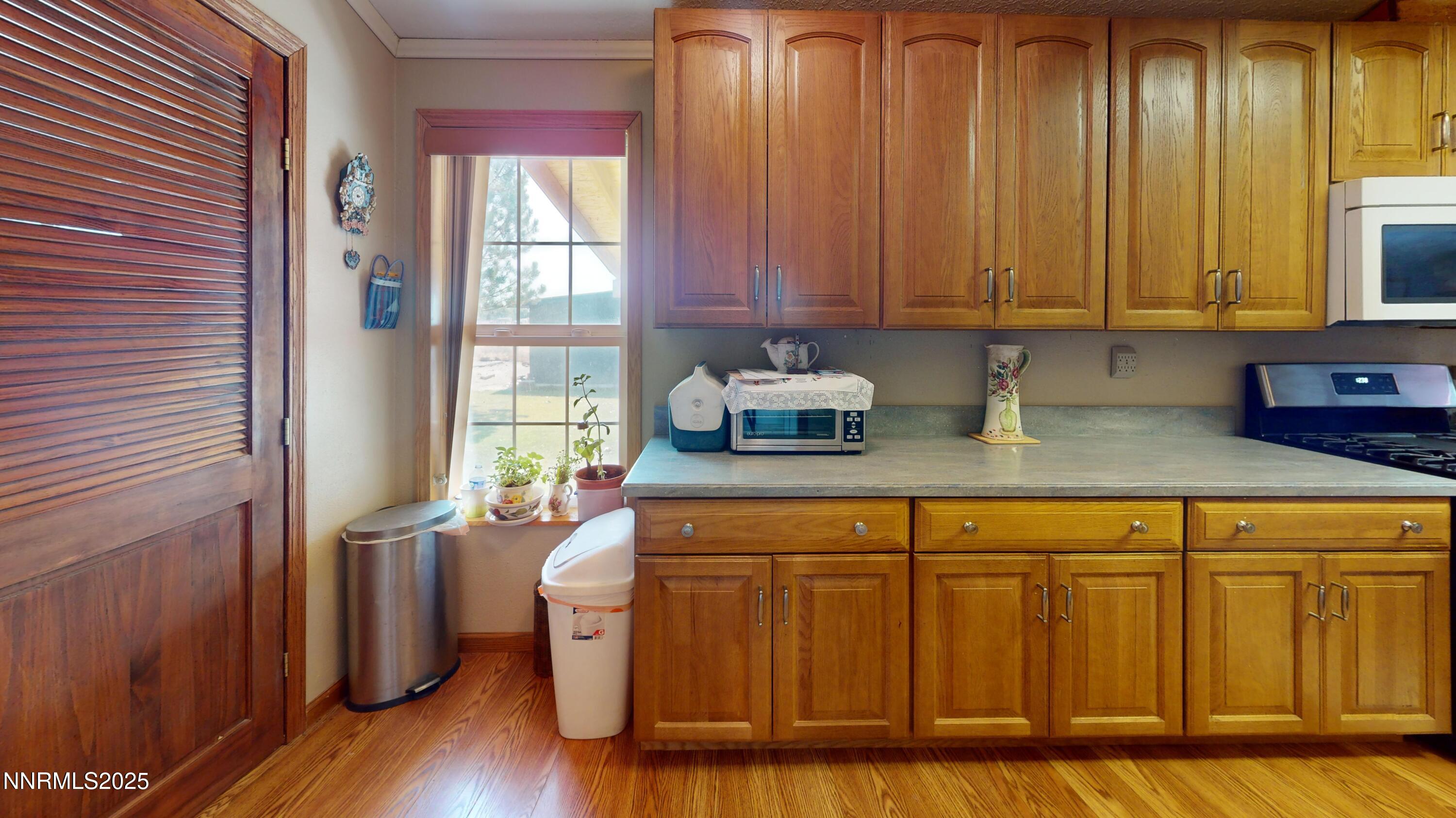3400 Potbelly Road Winnemucca, NV 89445 - Photo 11 of 50 a kitchen with stainless steel appliances granite countertop wooden cabinets a sink and dishwasher