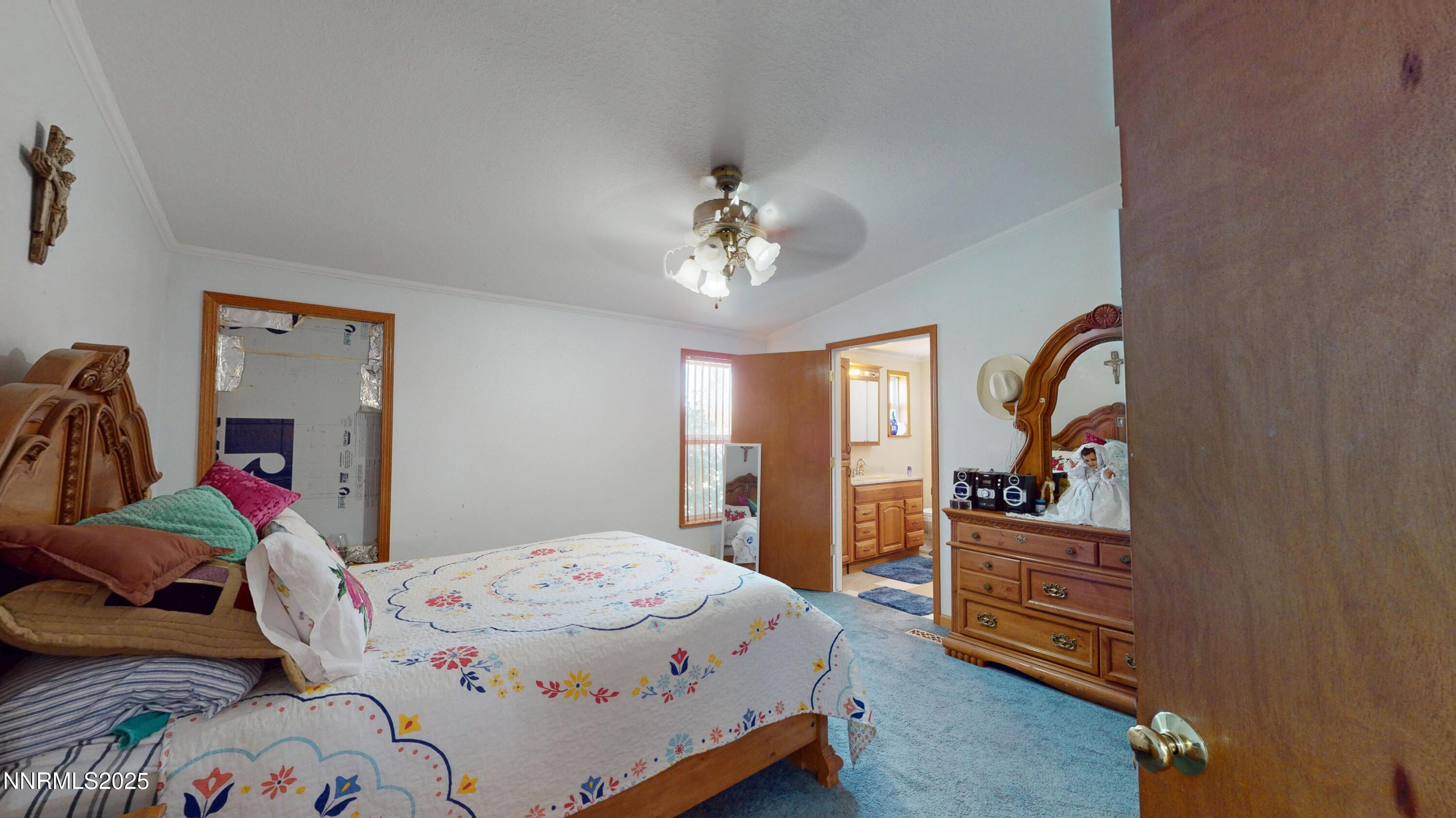 3400 Potbelly Road Winnemucca, NV 89445 - Photo 14 of 50 a bedroom with a bed and a dresser