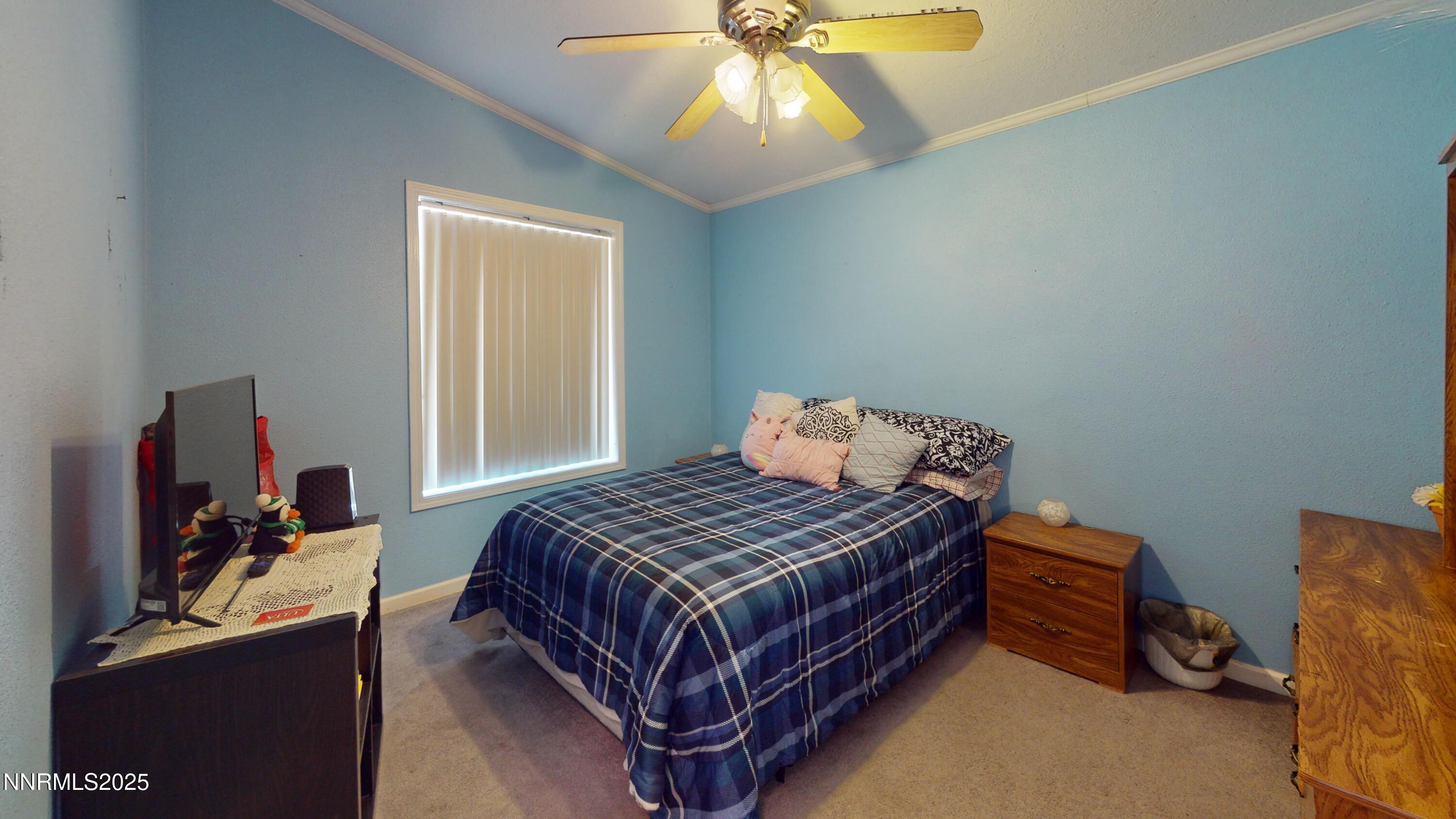 3400 Potbelly Road Winnemucca, NV 89445 - Photo 19 of 50 a bedroom with a bed and a chandelier