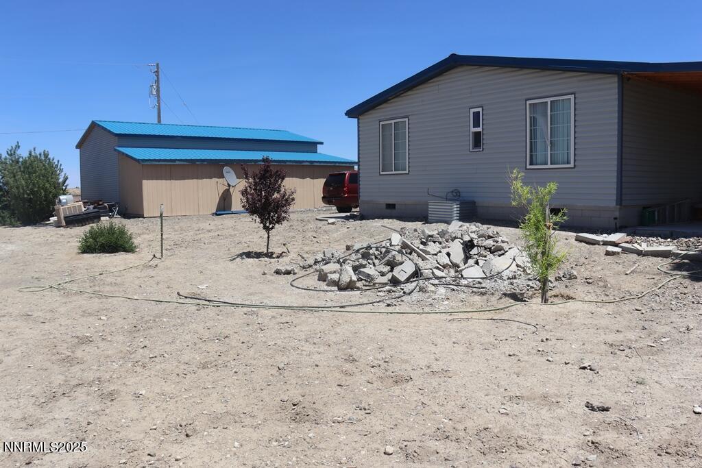 3400 Potbelly Road Winnemucca, NV 89445 - Photo 26 of 50 a view of a house with a yard covered in snow