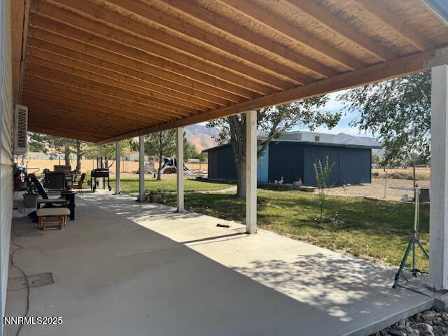 3400 Potbelly Road Winnemucca, NV 89445 - Photo 39 of 50 a patio with table and chairs and potted plants