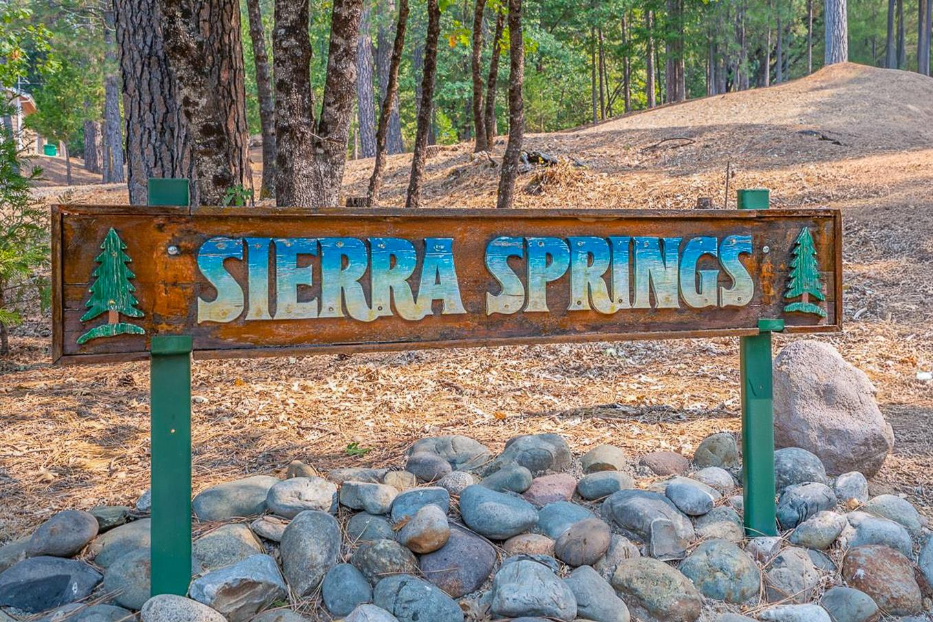 5015 Shooting Star Road Pollock Pines, CA 95726 - Photo 41 of 44 a view of a wooden house with a yard