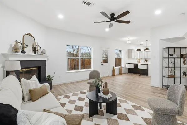 a living room with furniture and a fireplace