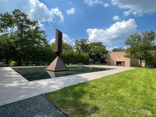 a view of a house with a yard and a garden