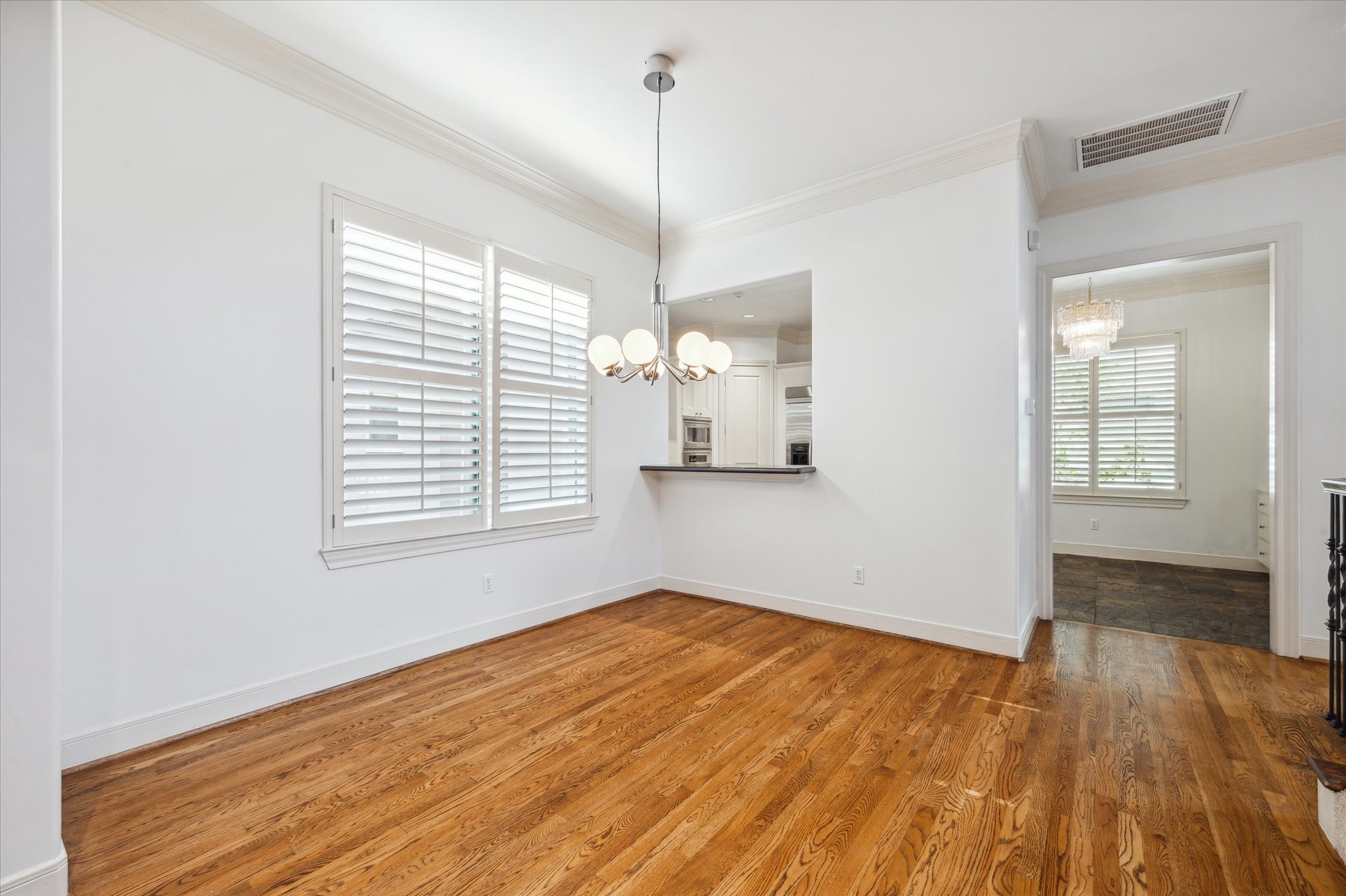 1826 Colquitt Street Houston, TX 77098 - Photo 7 of 23 a view of empty room with wooden floor and fan