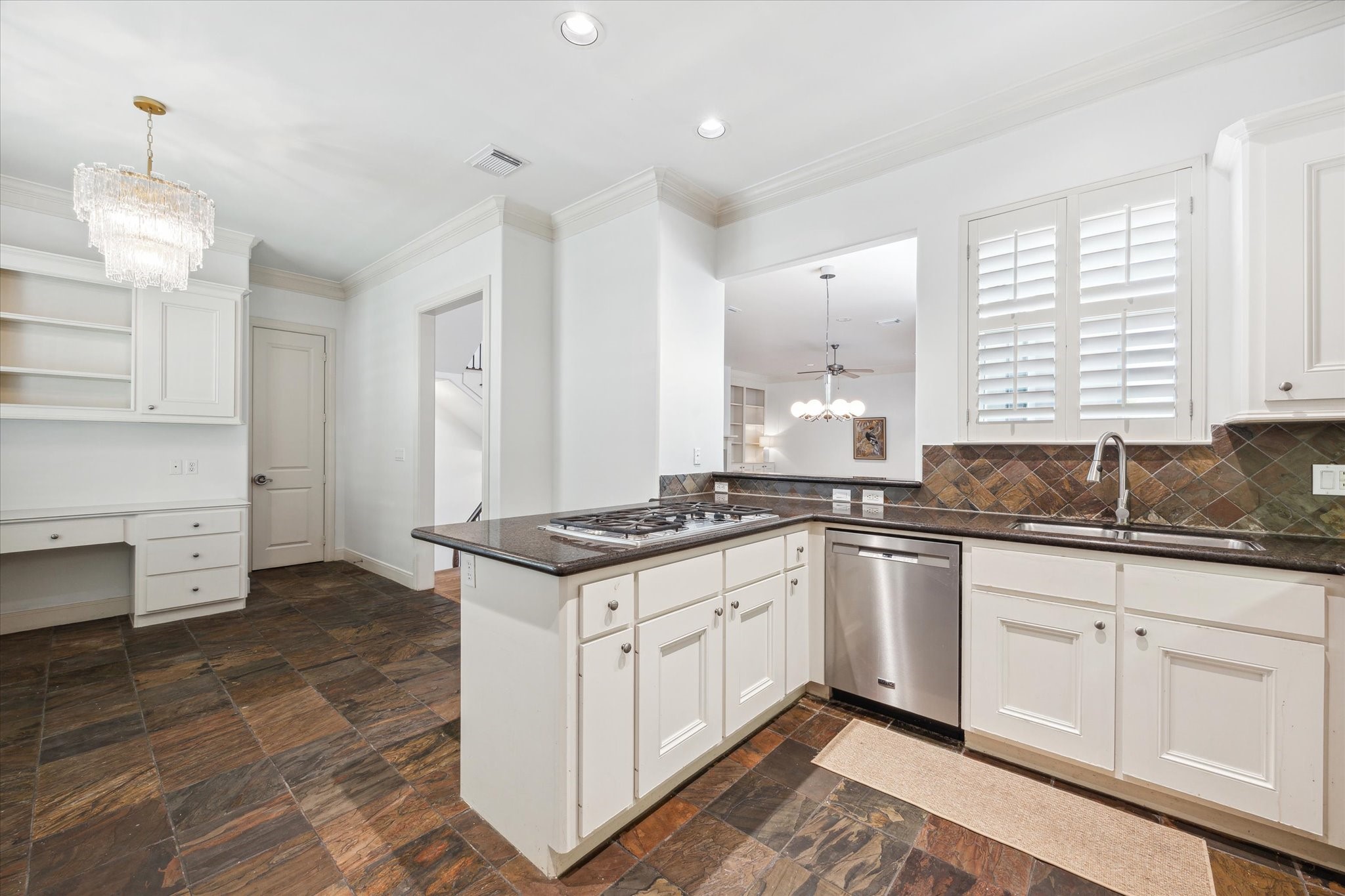 1826 Colquitt Street Houston, TX 77098 - Photo 9 of 23 a kitchen with granite countertop a sink stove and cabinets