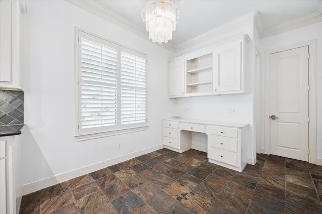 a room with a dresser and a window