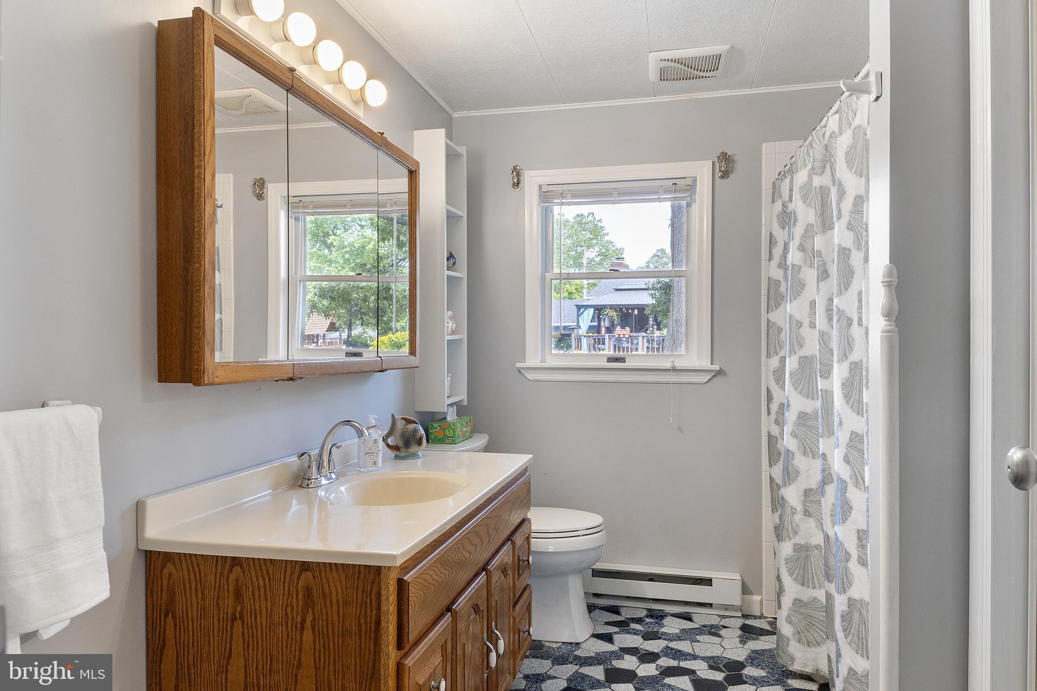 518 Laurel Road Riva, MD 21140 - Photo 17 of 42 a bathroom with a sink toilet a mirror and shower