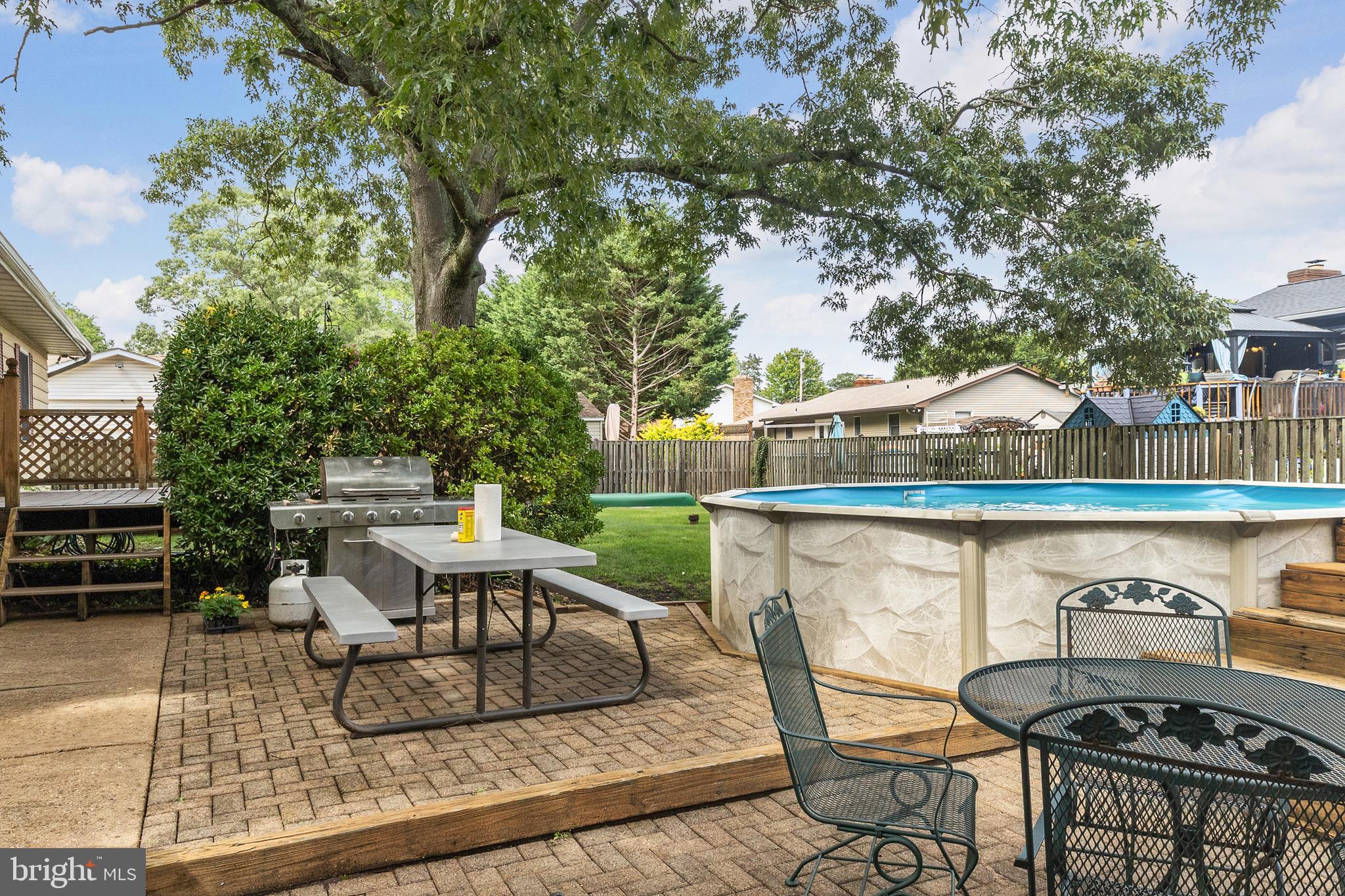 518 Laurel Road Riva, MD 21140 - Photo 28 of 42 a view of a patio with couches table and chairs and potted plants