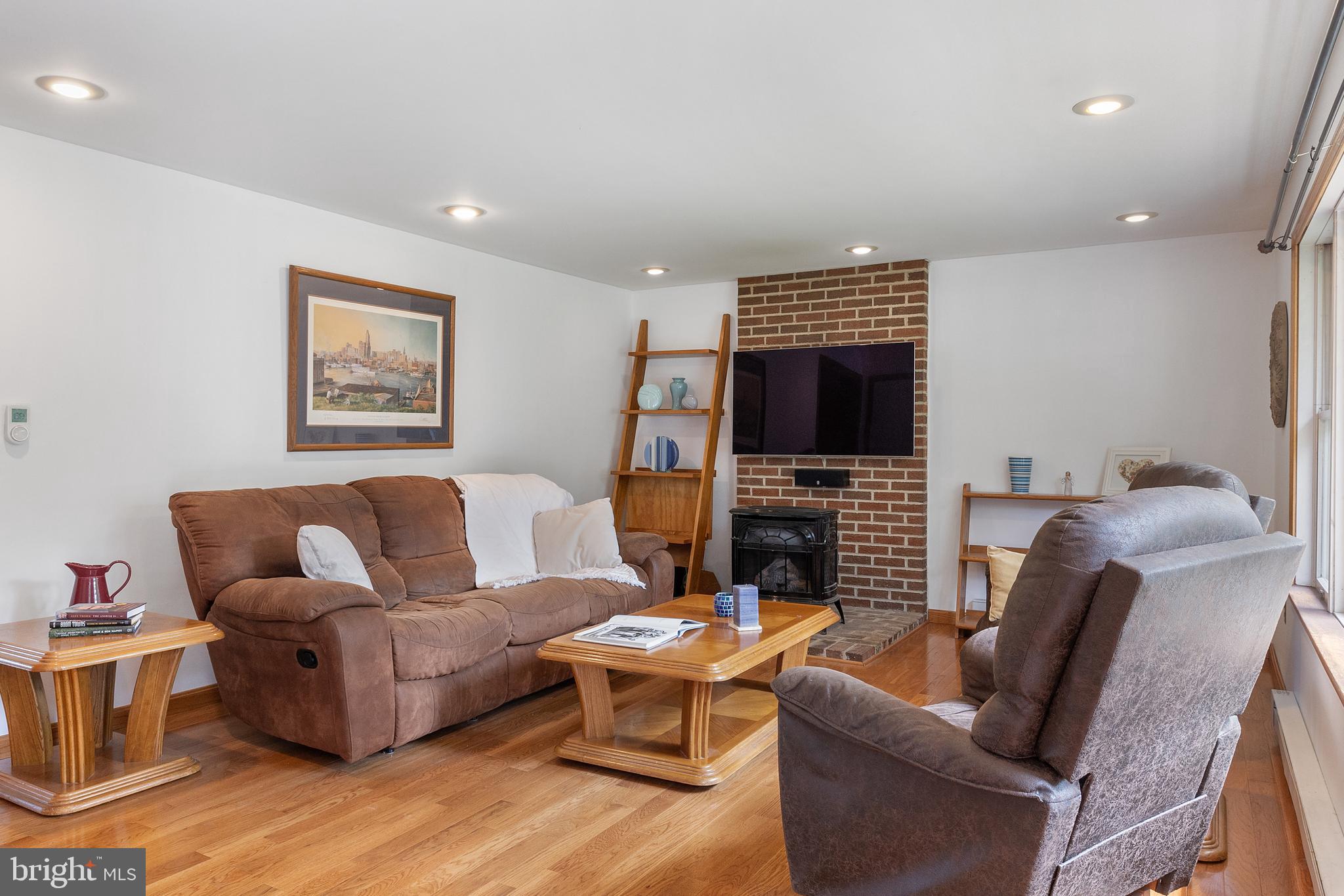 518 Laurel Road Riva, MD 21140 - Photo 4 of 42 a living room with furniture a flat screen tv and a fireplace