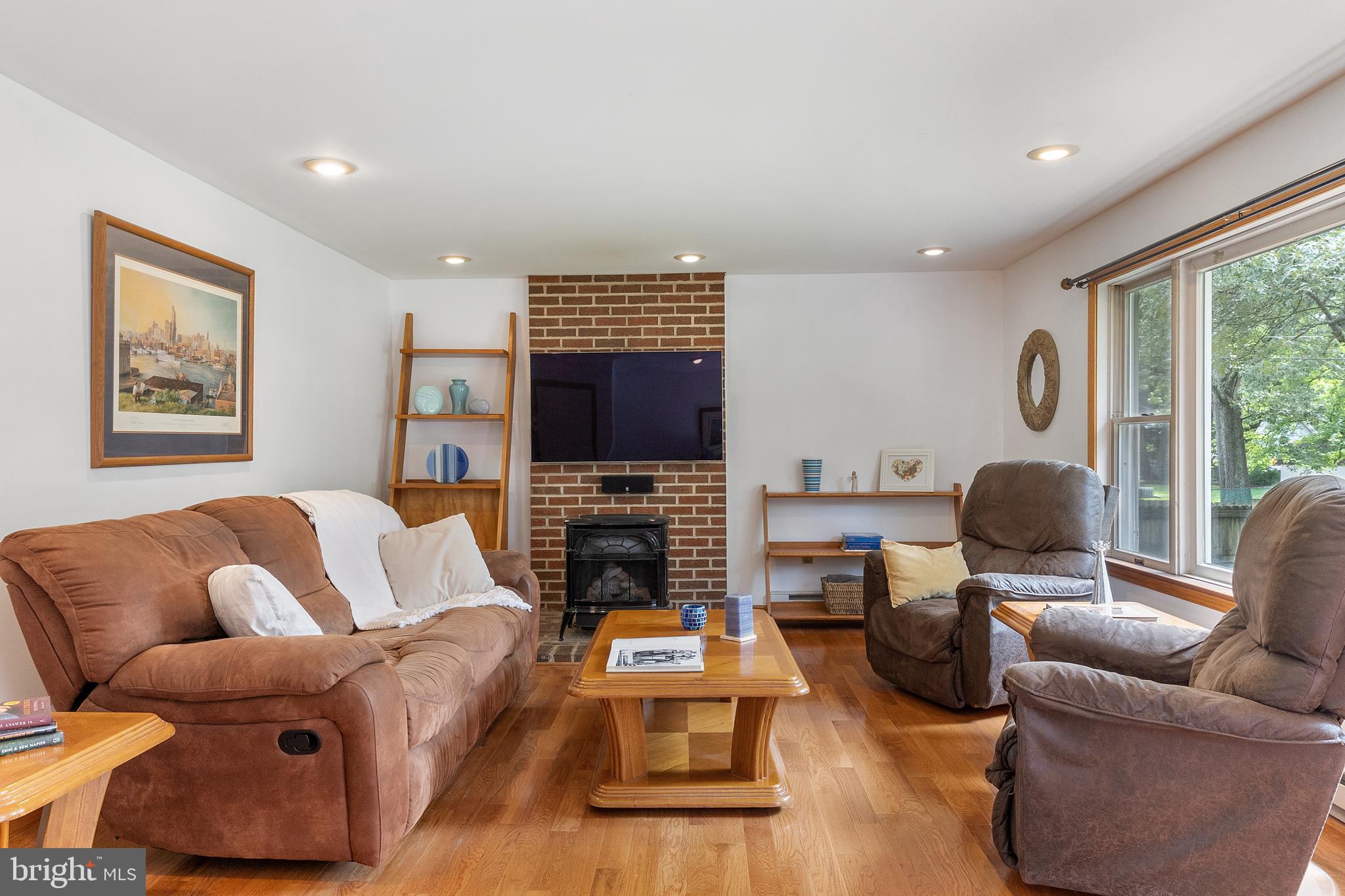 518 Laurel Road Riva, MD 21140 - Photo 5 of 42 a living room with furniture a fireplace and a flat screen tv