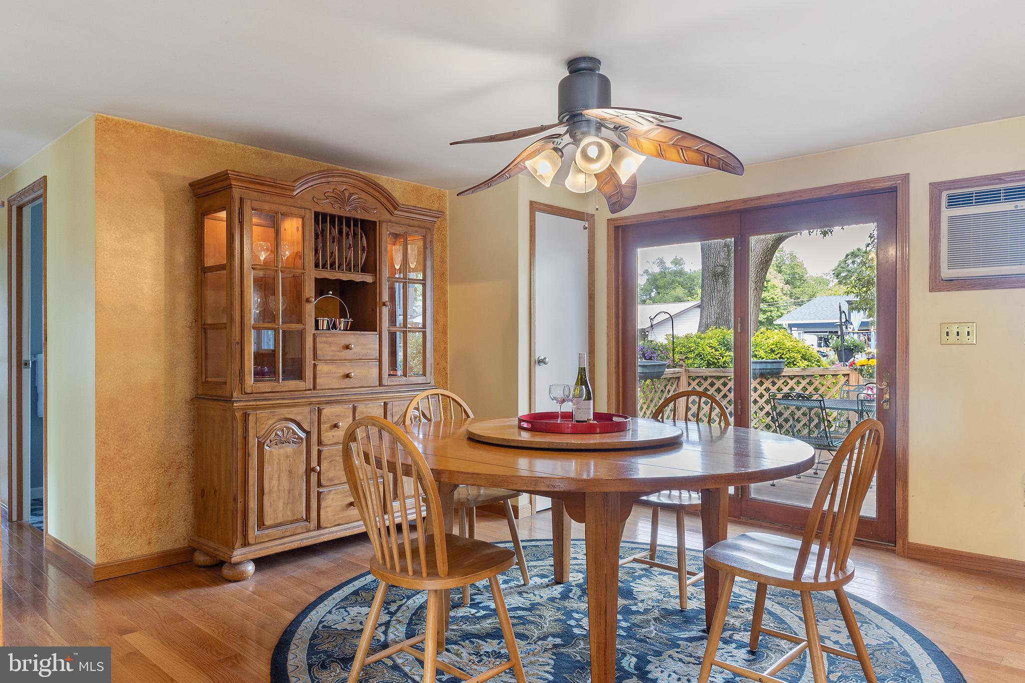 518 Laurel Road Riva, MD 21140 - Photo 10 of 42 a dining room with furniture a chandelier and wooden floor