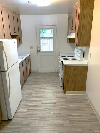 a bathroom with a sink a toilet a shower and a mirror