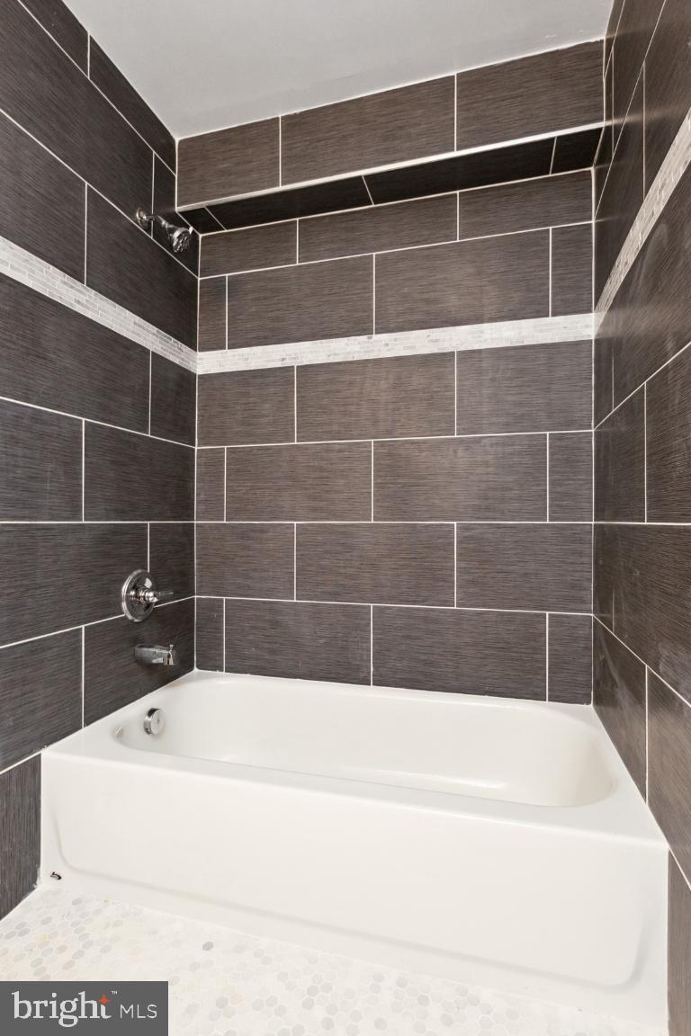 3900 14th Street Northwest, Unit 103 Washington, DC 20011 - Photo 18 of 29 a view of a bathtub in a bathroom