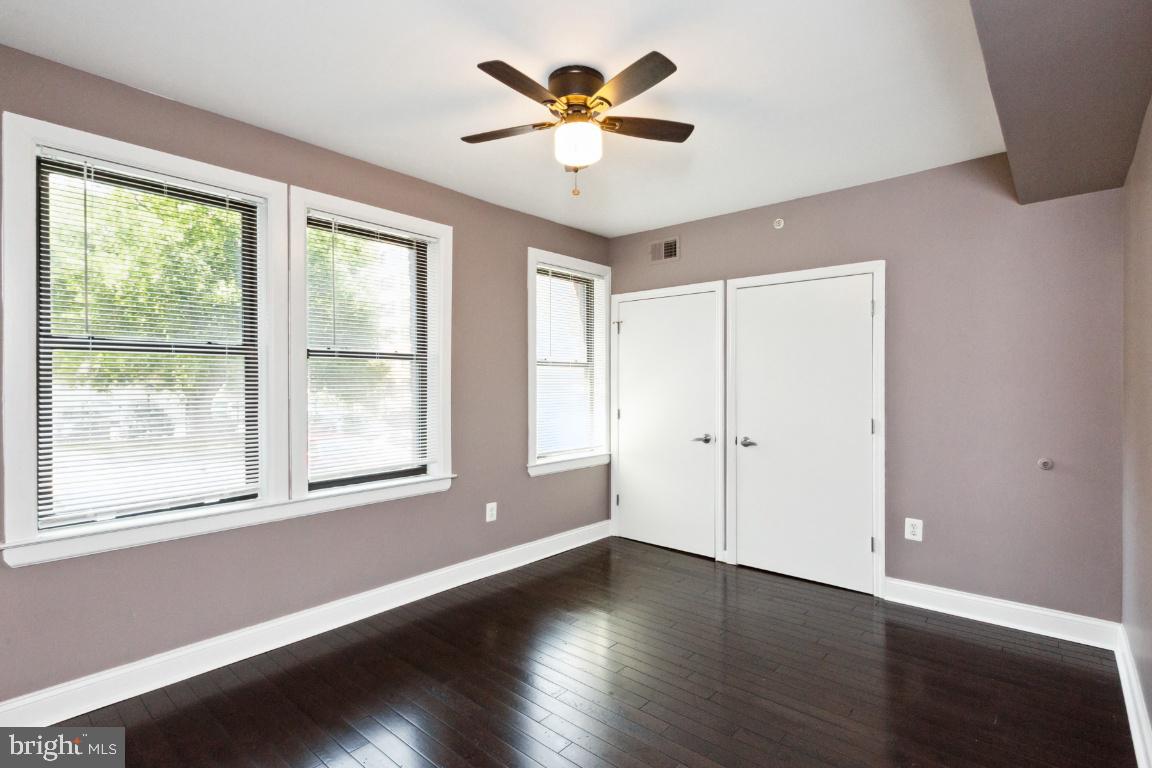 3900 14th Street Northwest, Unit 103 Washington, DC 20011 - Photo 20 of 29 a view of an empty room with window and wooden floor