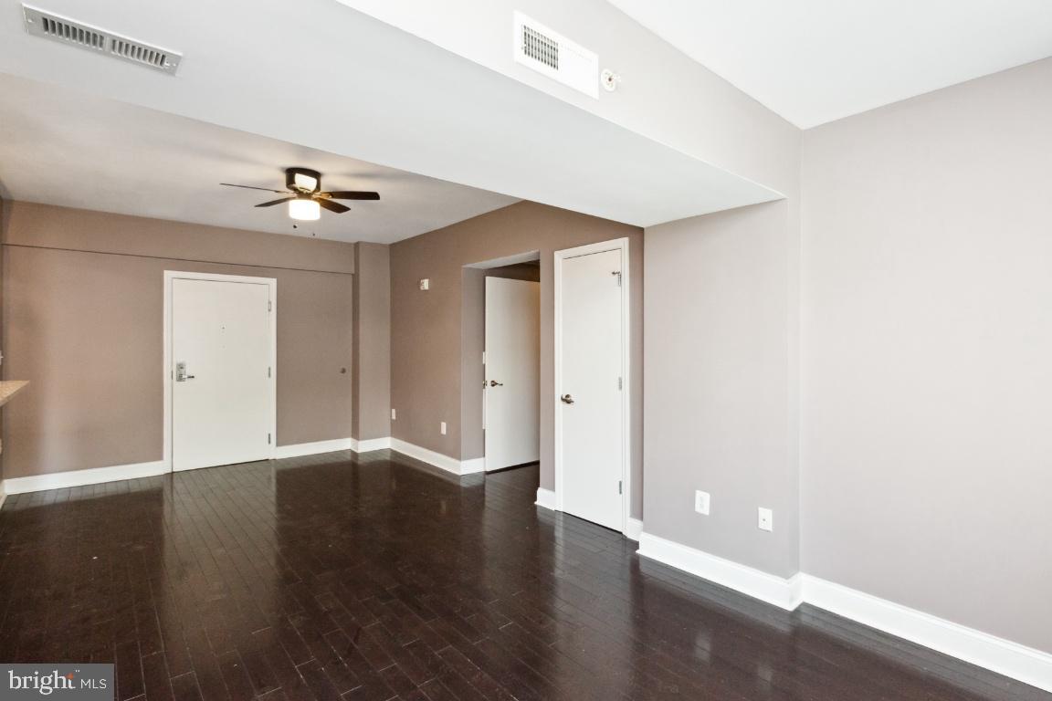 3900 14th Street Northwest, Unit 103 Washington, DC 20011 - Photo 5 of 29 a view of an empty room with wooden floor