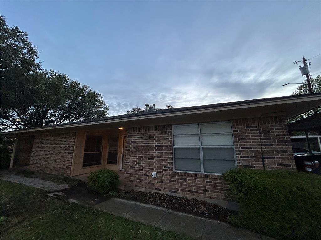 1302 Crescent Street Denton, TX 76201 - Photo 20 of 24 a front view of a house with a garden