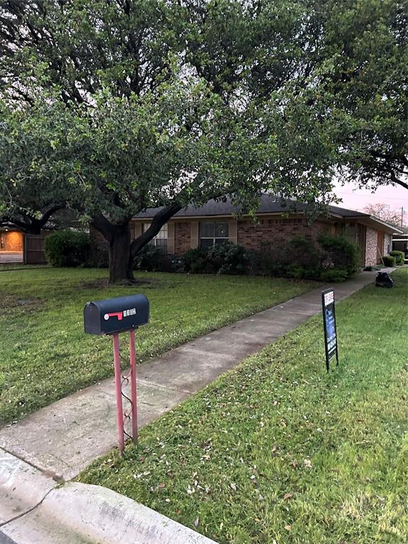 1302 Crescent Street Denton, TX 76201 - Photo 2 of 24 a front view of a house with a yard