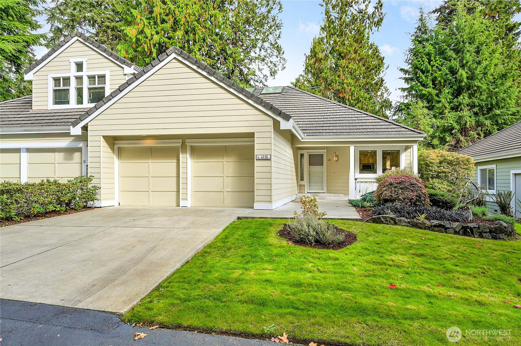 a front view of a house with a garden and porch