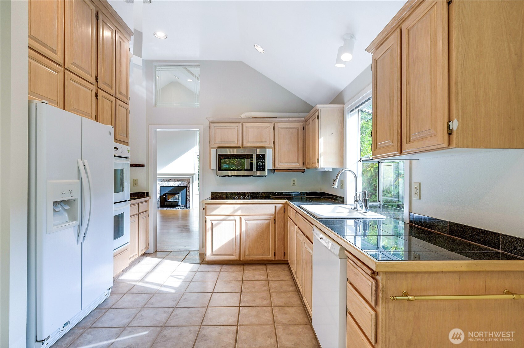41 South Keel Way, Unit B Port Ludlow, WA 98365 - Photo 13 of 39 a kitchen with a refrigerator a sink and a stove top oven