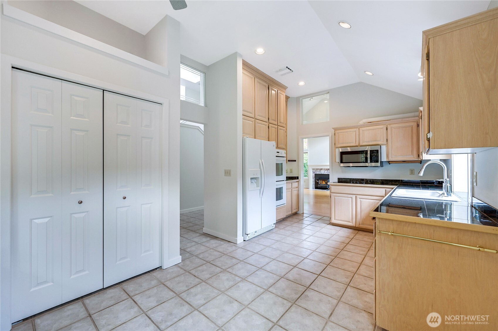 41 South Keel Way, Unit B Port Ludlow, WA 98365 - Photo 15 of 39 a kitchen with stainless steel appliances granite countertop a refrigerator and a stove top oven