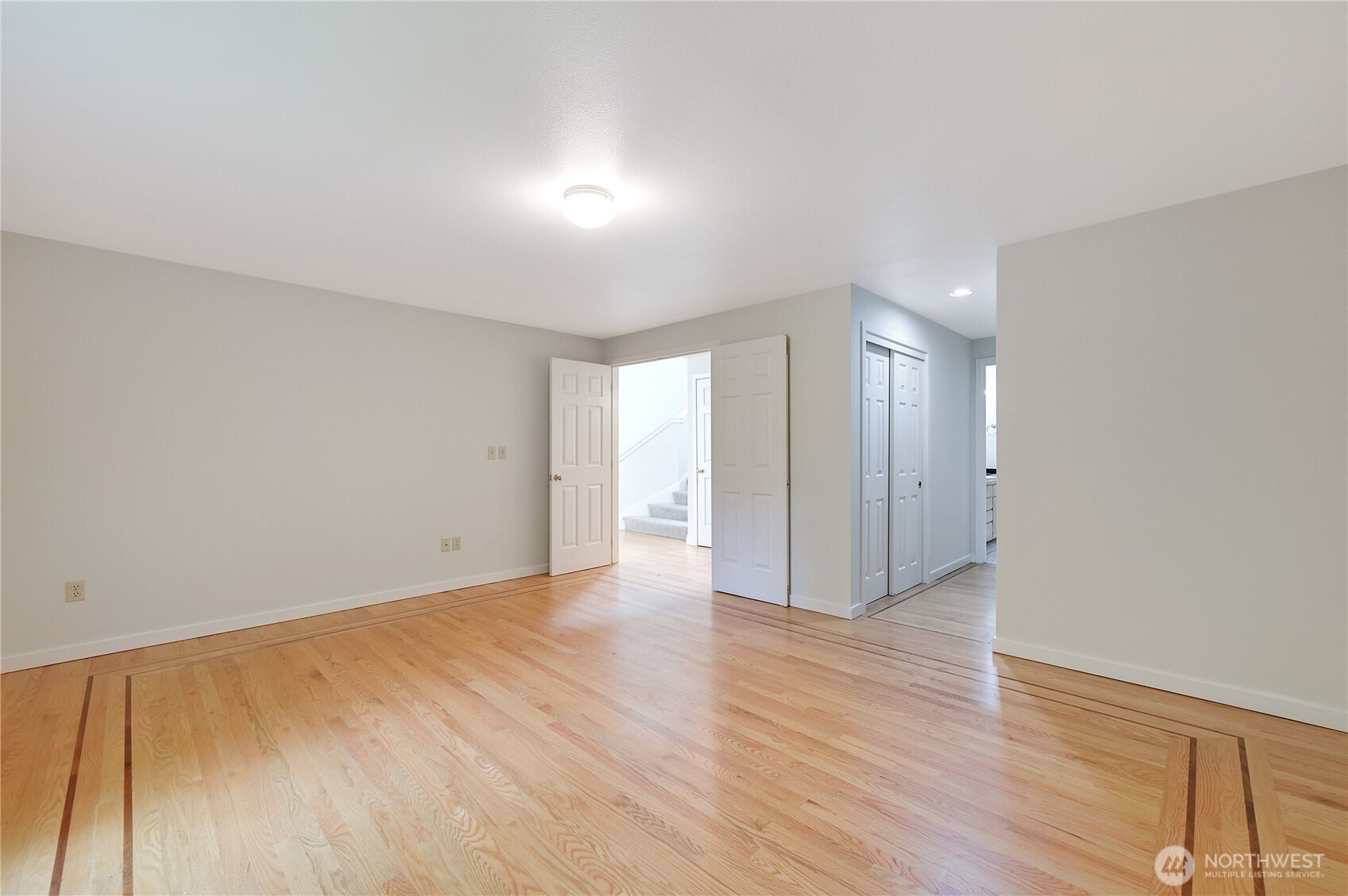 41 South Keel Way, Unit B Port Ludlow, WA 98365 - Photo 24 of 39 a view of an empty room with wooden floor
