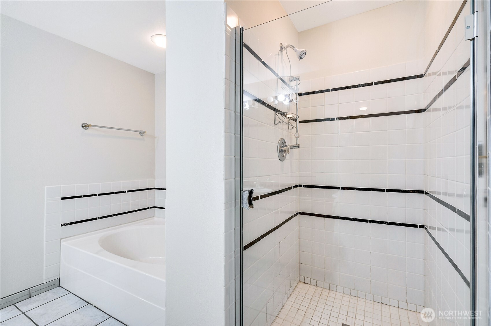 41 South Keel Way, Unit B Port Ludlow, WA 98365 - Photo 27 of 39 a bathroom with a white bath tub and a shower