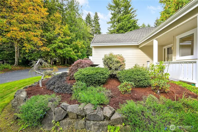 a front view of a house with garden
