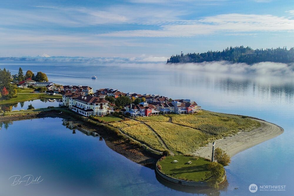 41 South Keel Way, Unit B Port Ludlow, WA 98365 - Photo 6 of 39 a view of a lake with a table and chairs