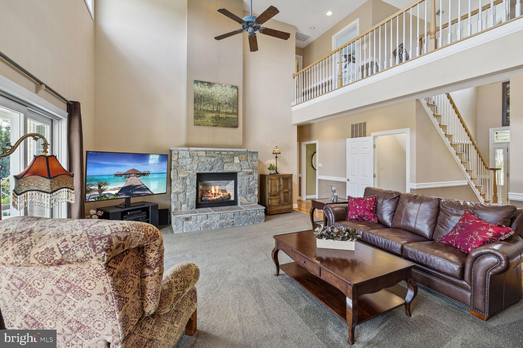 9649 Watkins Road Gaithersburg, MD 20882 - Photo 20 of 81 Gas Fireplace with stone surround and hearth