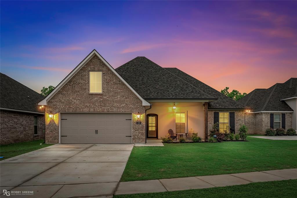 122 Brimestone Loop Benton, LA 71006 - Photo 1 of 33 a front view of a house with a yard and garage
