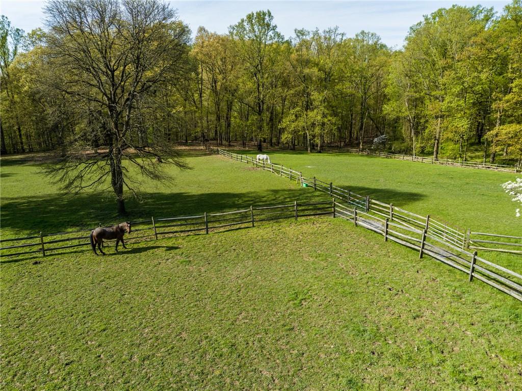45 Stonedale Road Sewickley, PA 15143 - Photo 10 of 35 a view of a swimming pool with a garden and trees