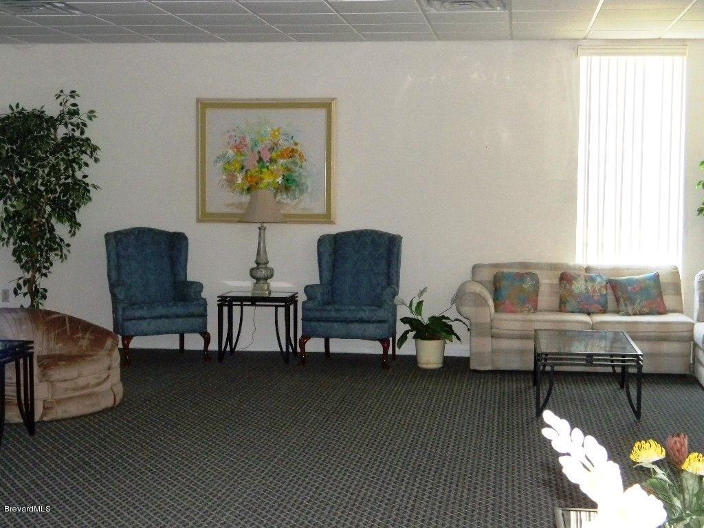 2727 North Wickham Road, Unit 2064 Melbourne, FL 32935 - Photo 11 of 13 Clubhouse Living Room